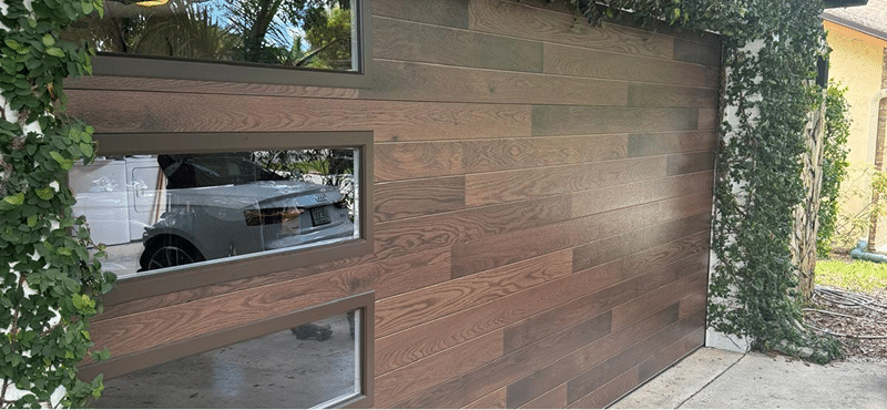 Modern contemporary glass garage door South Florida residential