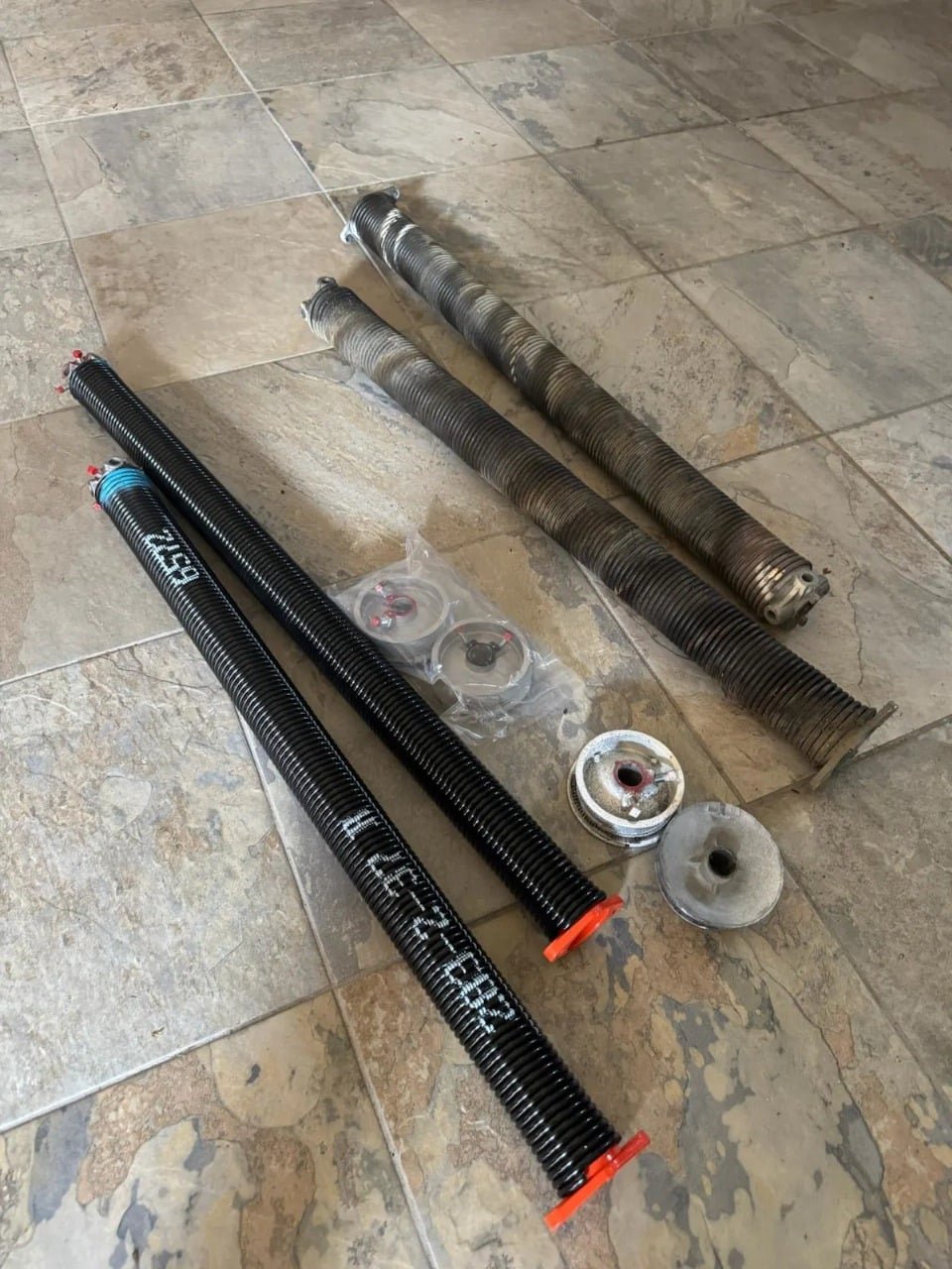 Garage Door Kingdom spring replacement service in Sunrise, FL — professional torsion spring installation with full door balancing included