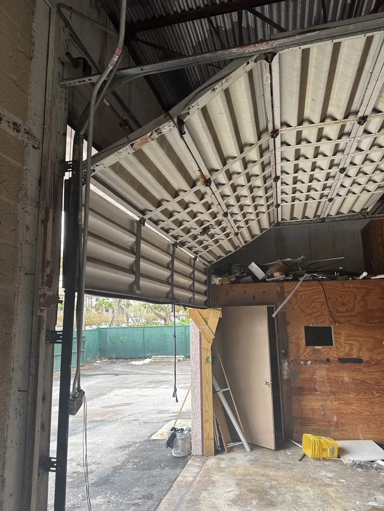 Commercial roll-up garage door emergency repair Sunrise FL
