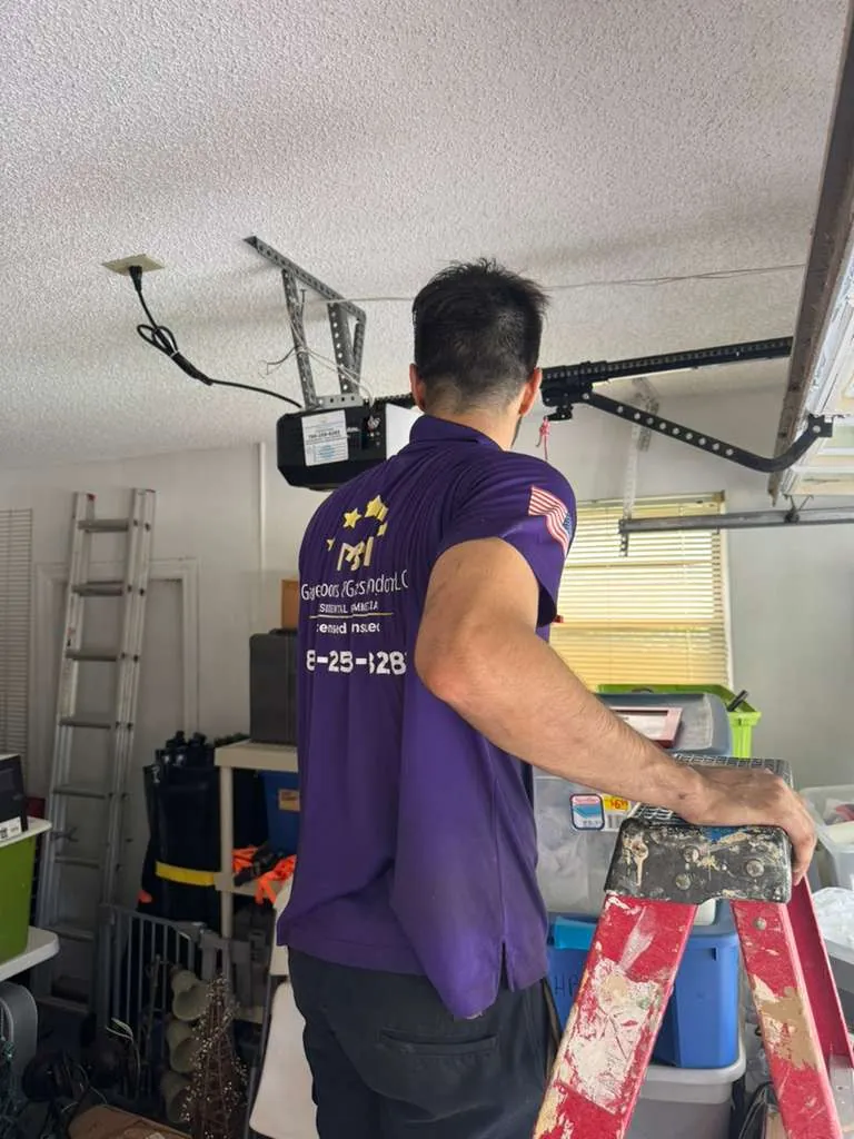 Licensed Garage Door Kingdom technician installing new LiftMaster opener after springs replacement in Tamarac, FL